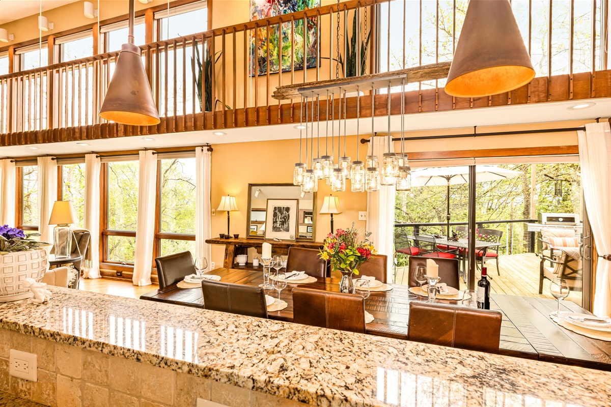 Views of dining area, view, catwalk above, and deck to the right. So many options for having fun!