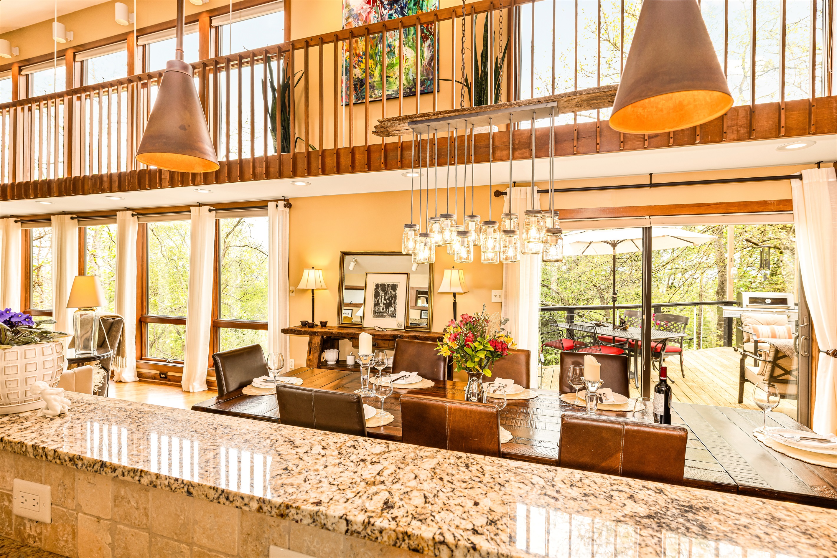 Views of dining area, view, catwalk above, and deck to the right. So many options for having fun!