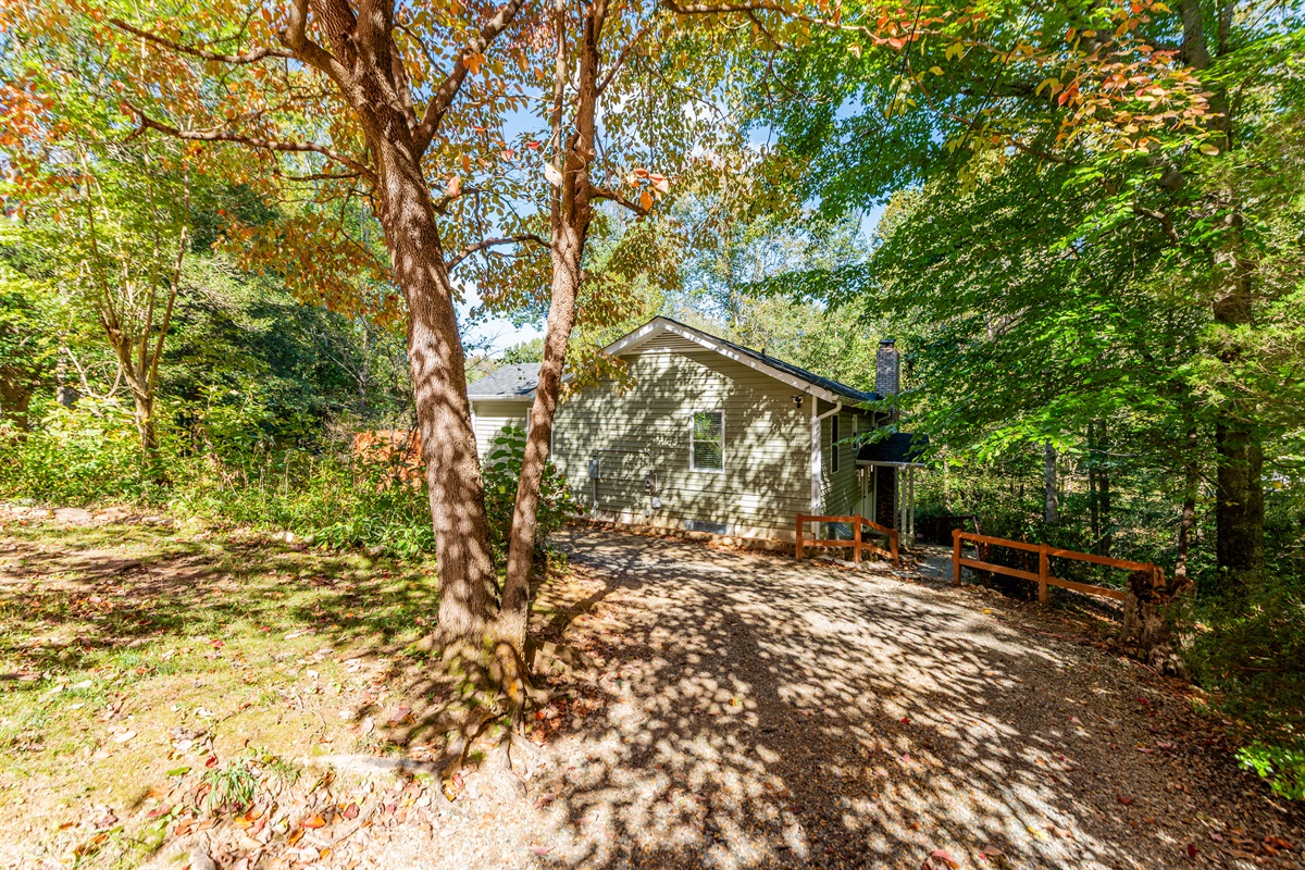 Exterior: Embrace tranquility in this nature-surrounded haven with vibrant foliage!