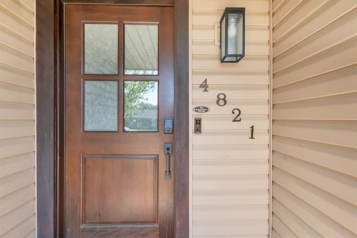 A charming front entry sets the tone for a stylish and comfortable stay