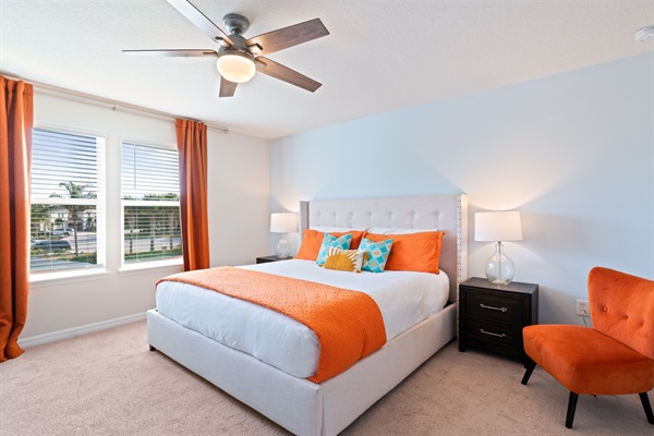 Relax in the spacious Master Suite, featuring a luxurious King bed, work desk, and a walk-in closet for ultimate comfort.