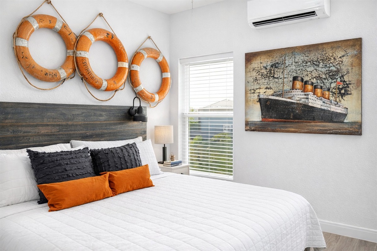 Titanic Primary Suite (Main Floor): King bed with coastal charm — this suite includes a private ensuite bathroom.