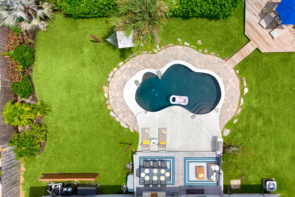 Bird's eye view of your sparkling pool and wide open play space