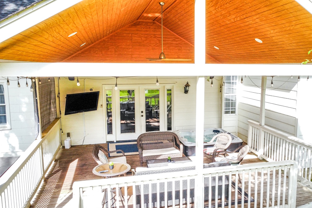 Covered deck with hot tub and TV