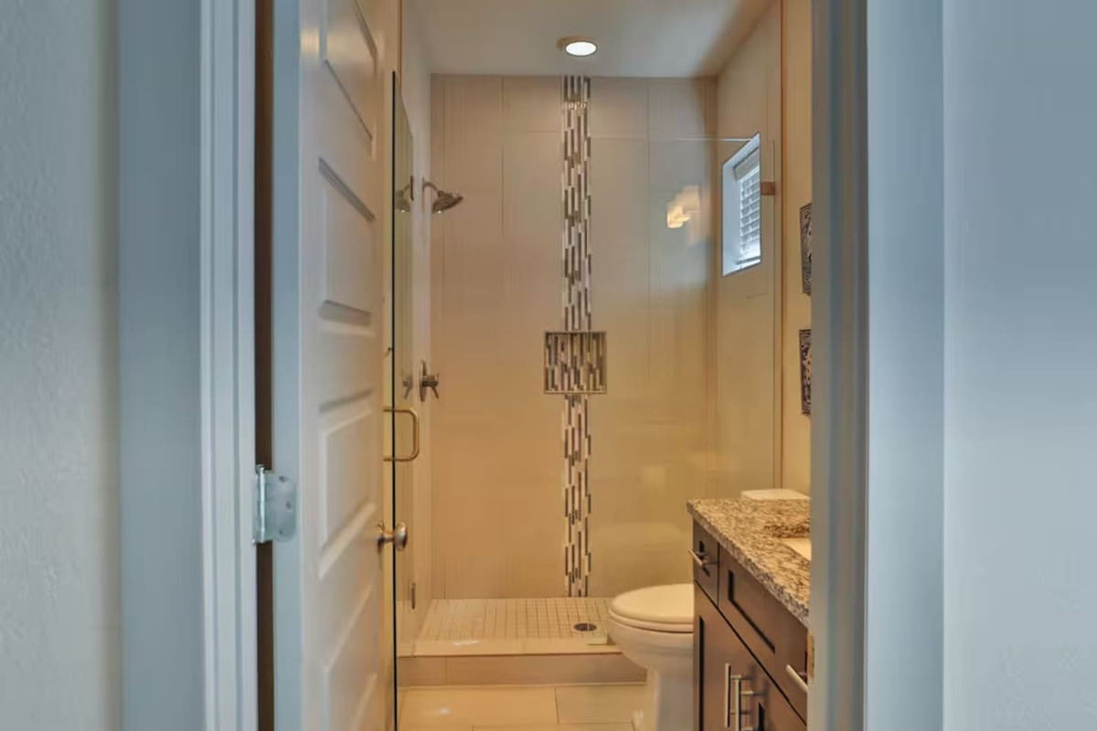 full bathroom ensuite with bedroom 3 straight view

