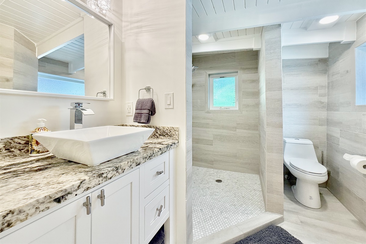 With it's own ensuite, closet, and huge walk in shower.