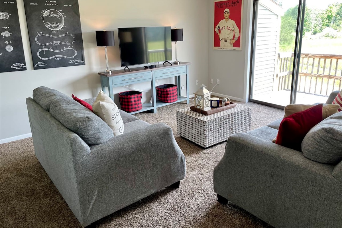 Cozy living room with access to back deck.  
