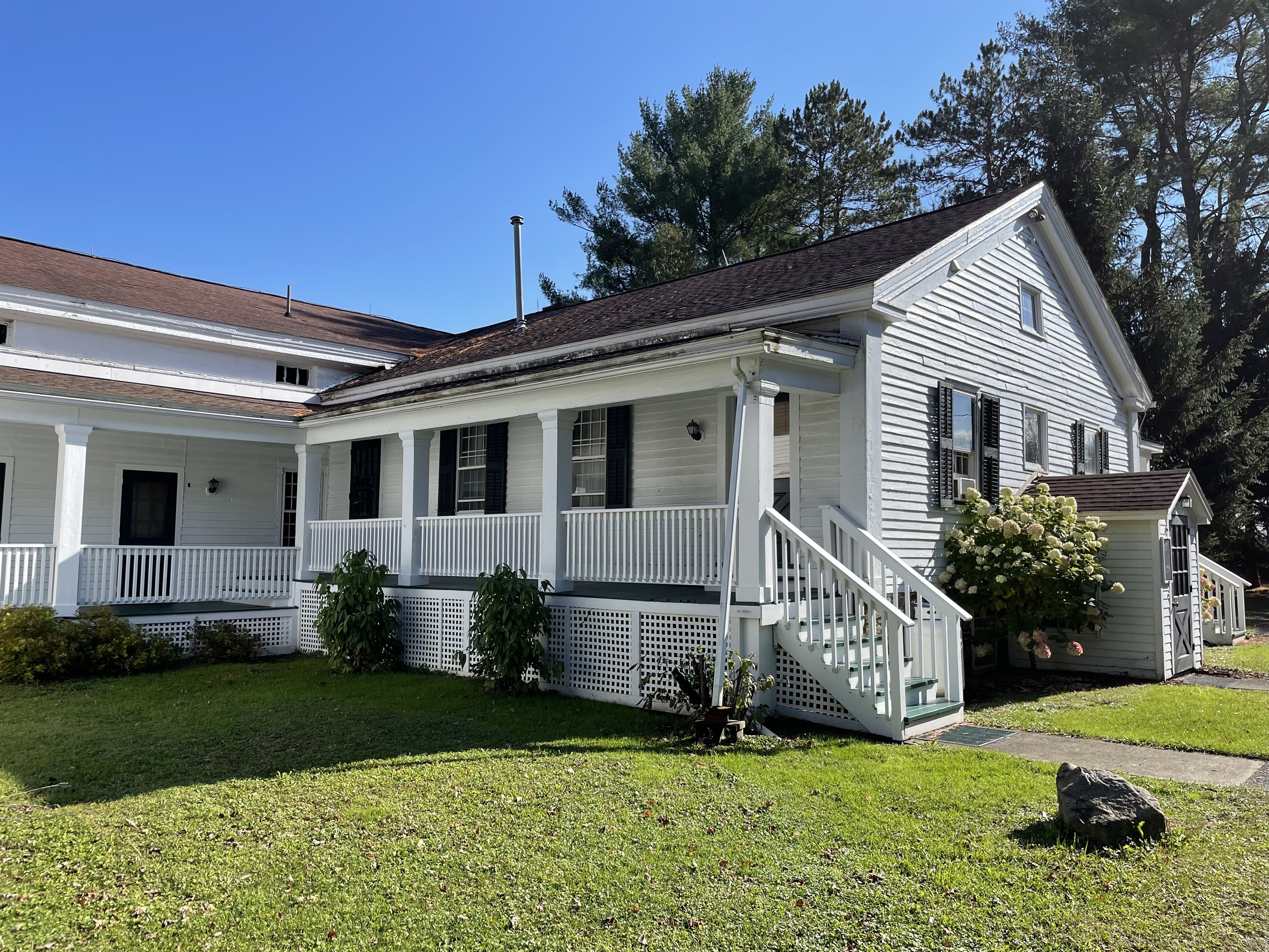 Rear covered porch stairs lead to room #3 and the laundry room.