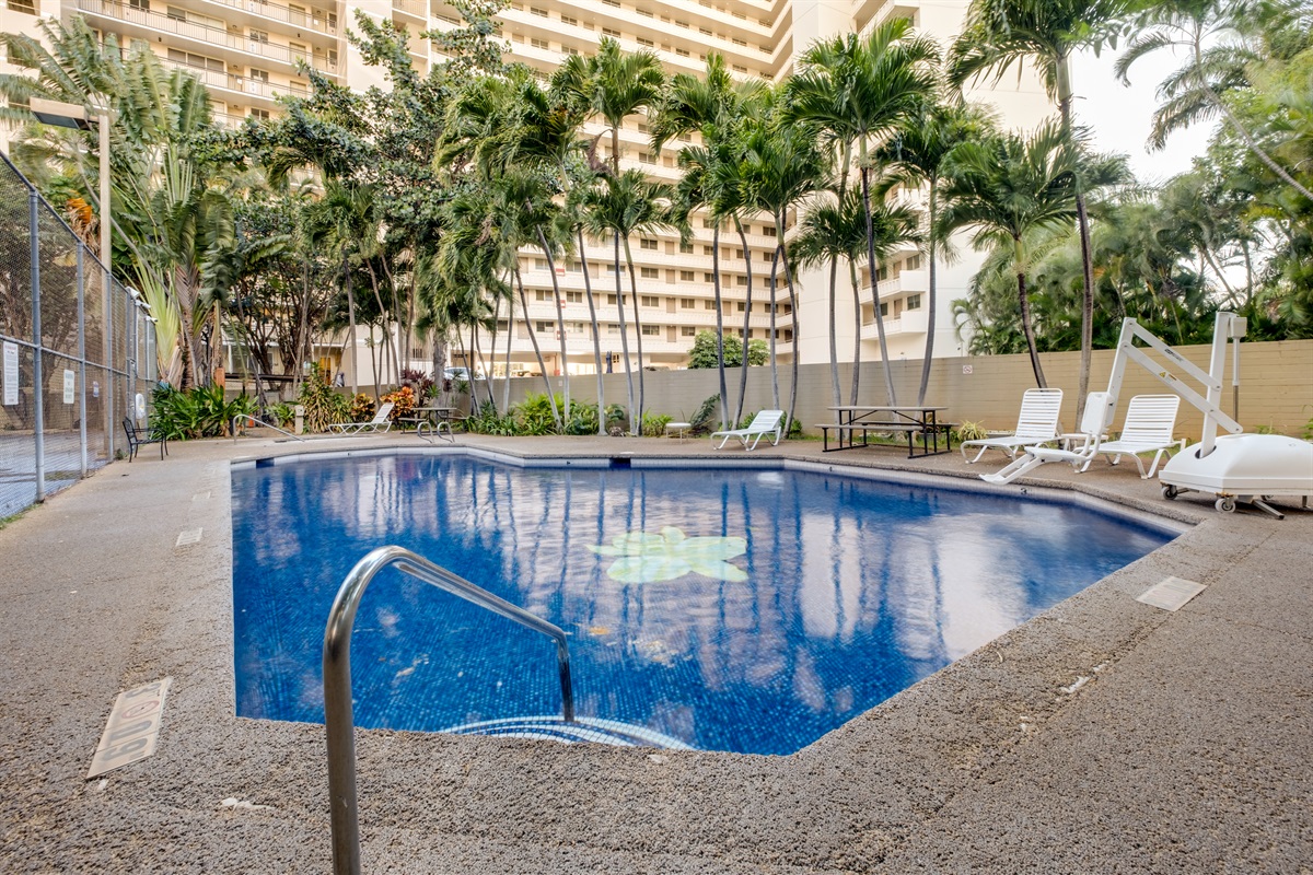 Take a dip in this tropical retreat surrounded by swaying palms and island serenity.
