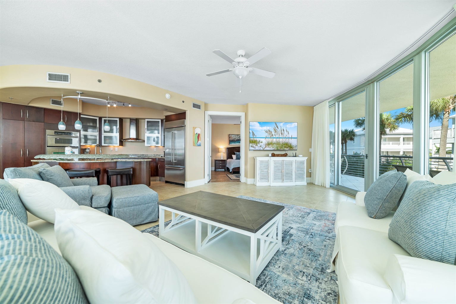 A light-filled living space with captivating views. This inviting room offers a perfect blend of comfort and style, creating a welcoming atmosphere for all.