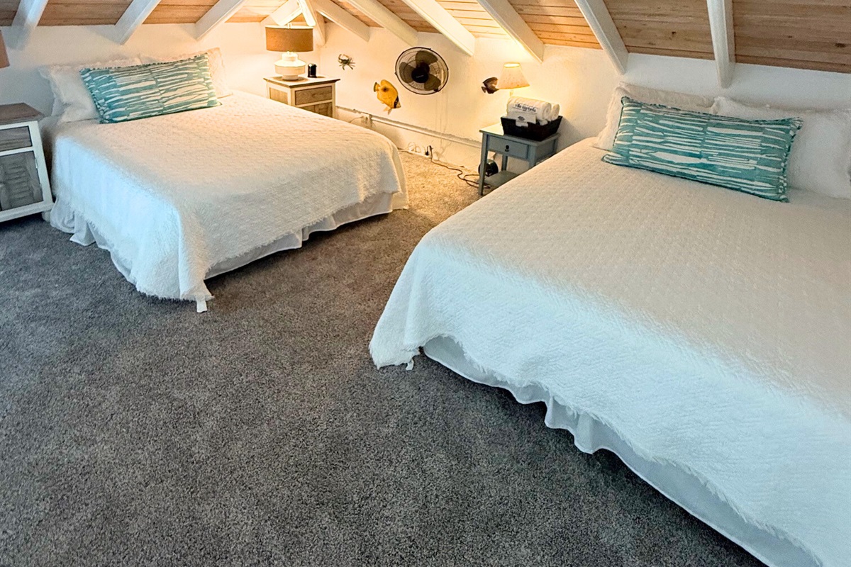 Two comfortable queen mattresses complete this room - perfect for kids, teens or couples who don't mind sharing!