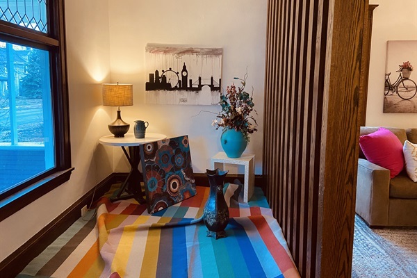 Artsy Sunroom adjacent to living room.