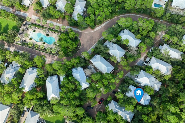 Resort-Style Pool - A quick walk through the stone path across the street takes you to the pool shared only with Creek Park at Magnolia homes. Surrounded by palms and lounge chairs, it’s perfect for swimming, relaxing, and soaking up the 30A sun.