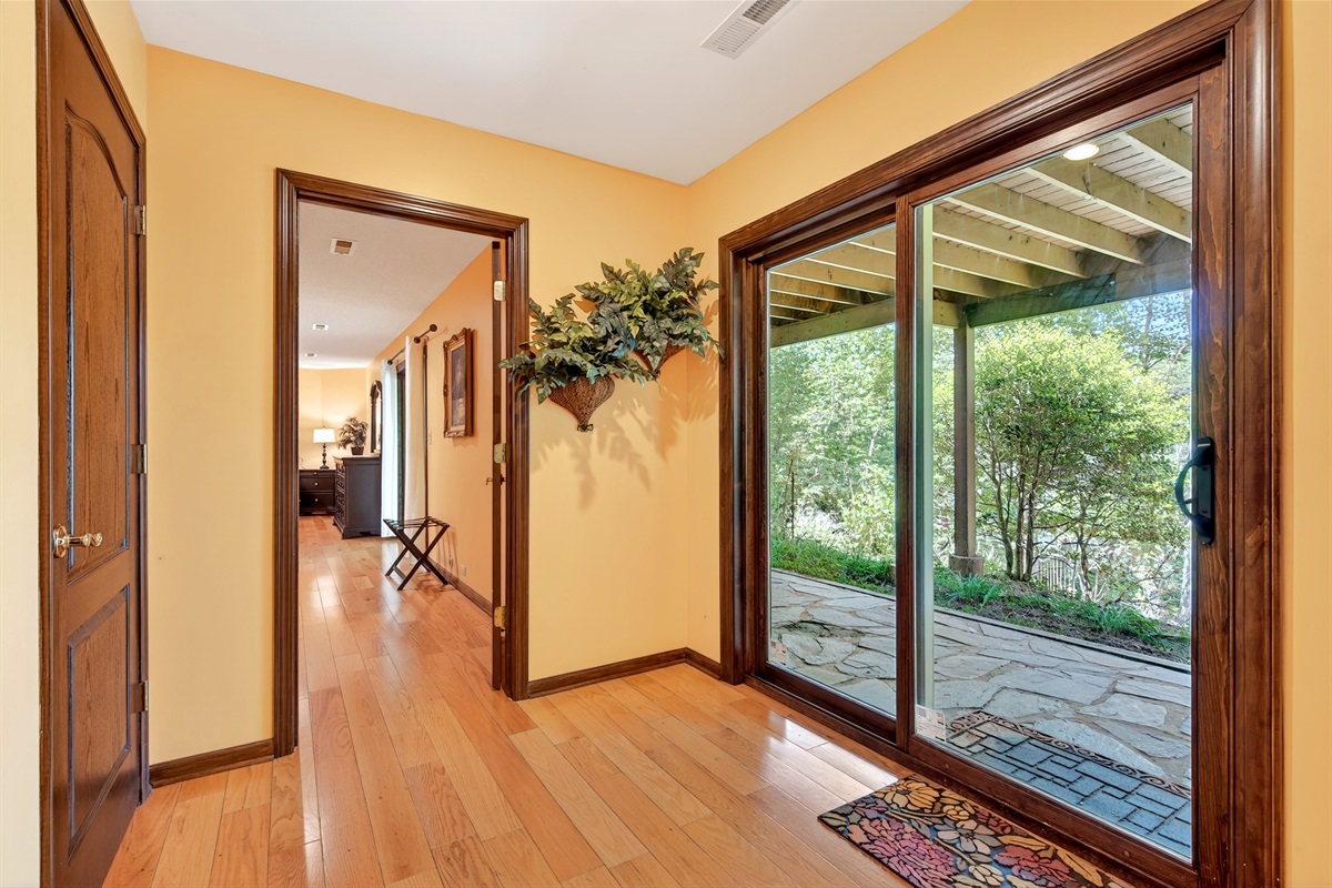 Lower level hallway that has easy access to the back yard
