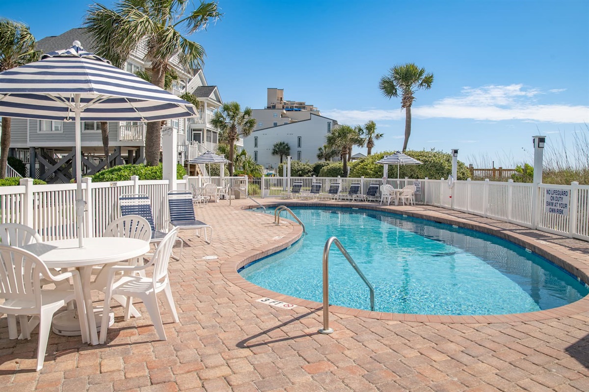 Enjoy the Portofino shared pool.  Ten houses share this beautiful pool located directly in front of Portofino 1424.  The pool deck boasts 4 tables with umbrellas and multiple lounge chairs.  Hi The pool is heated in April, May, September and October 