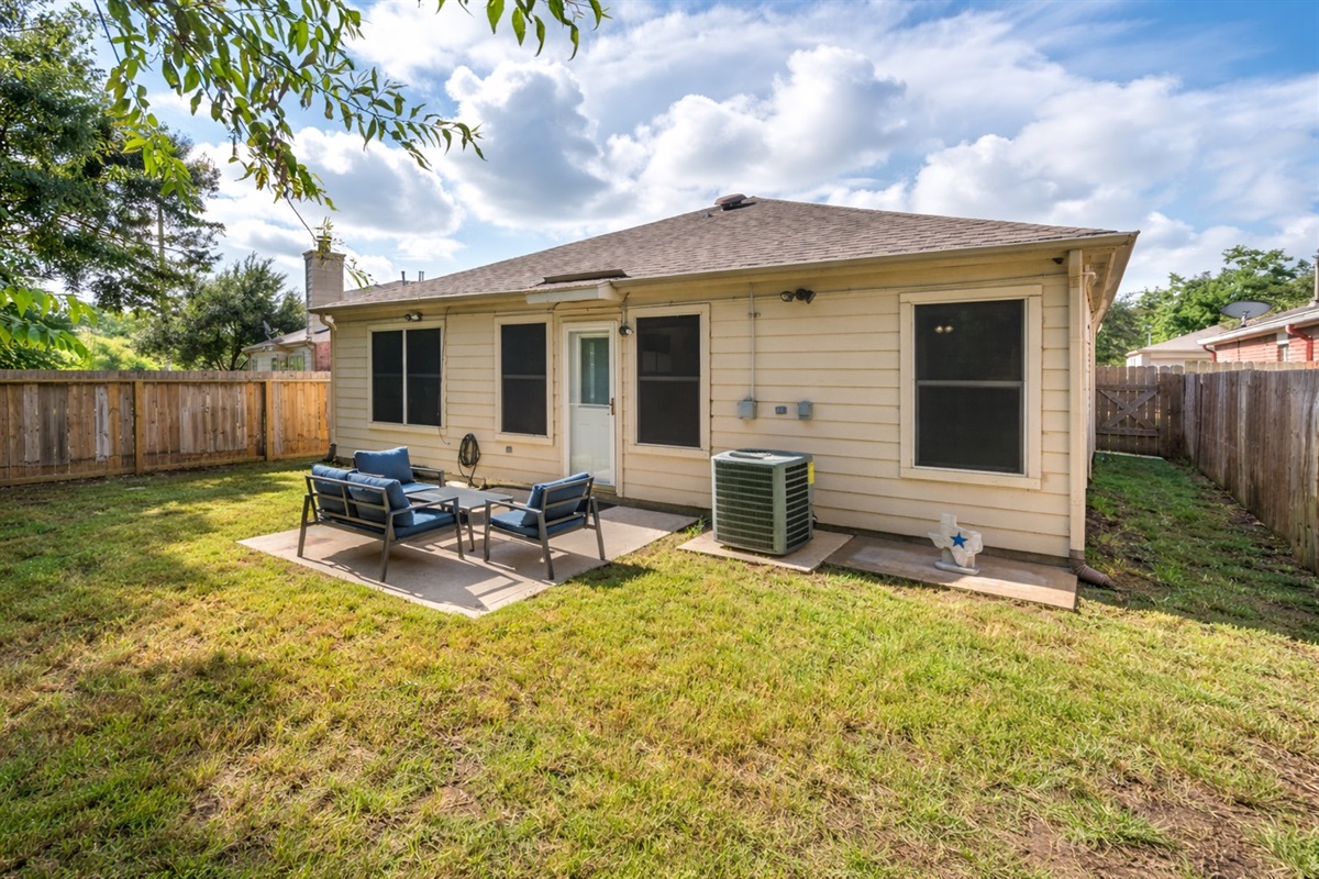 Spacious outdoor area for BBQs, games, and relaxation.
