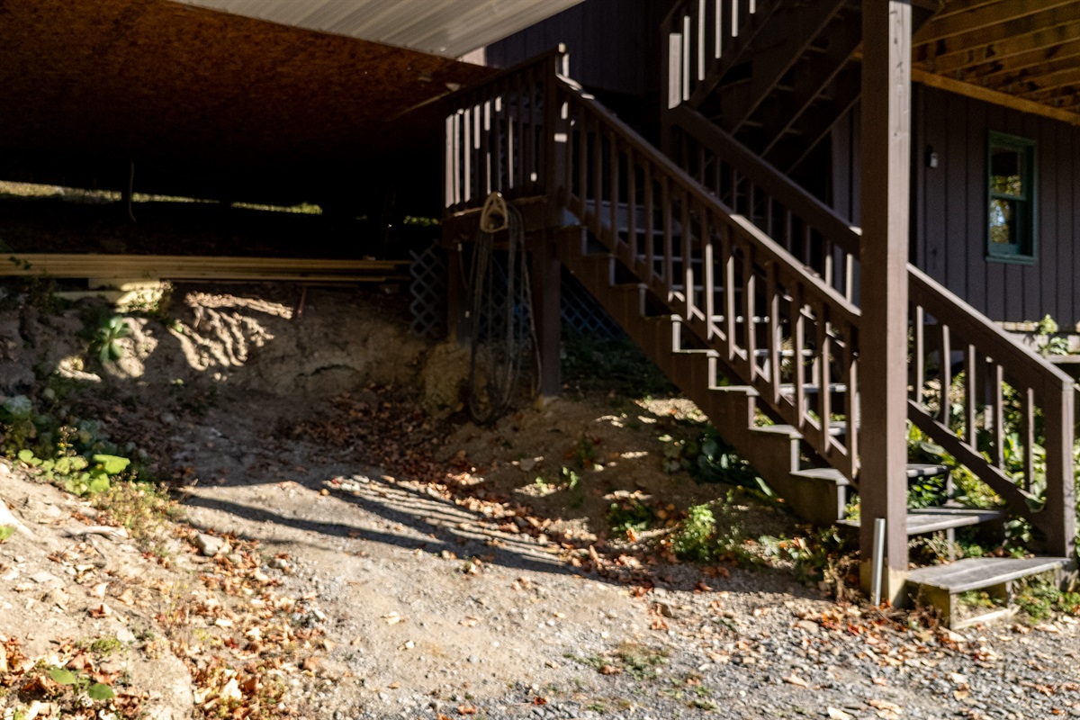 Deck stairs and skirt area beneath deck showing usable space.