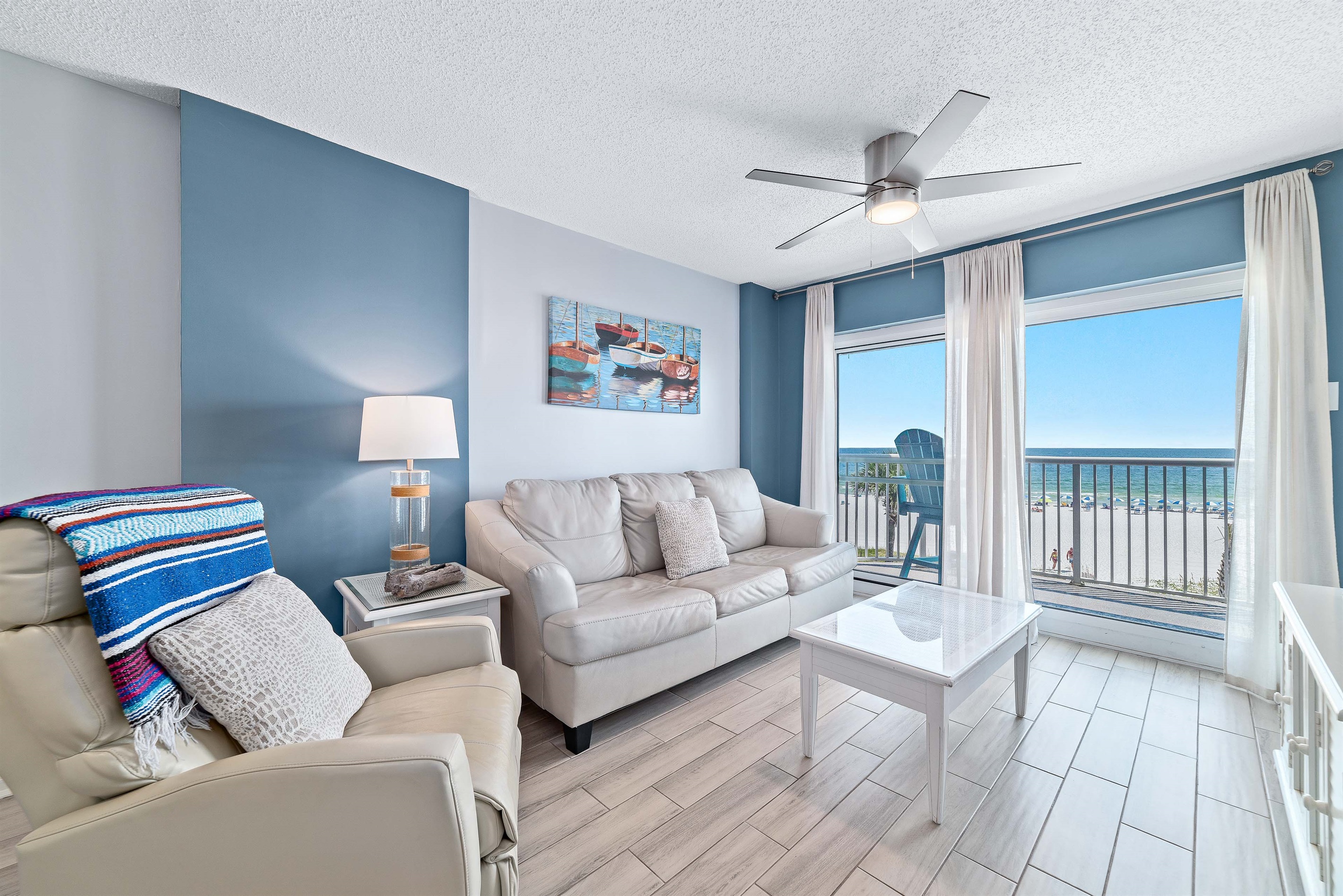 The seamless transition to the outdoor balcony enhances the sense of light and openness.