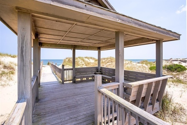 A shaded escape with the sea as your soundtrack.