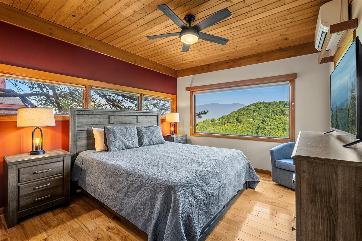 Upstairs King bedroom with windows to enjoy the natural beauty outside