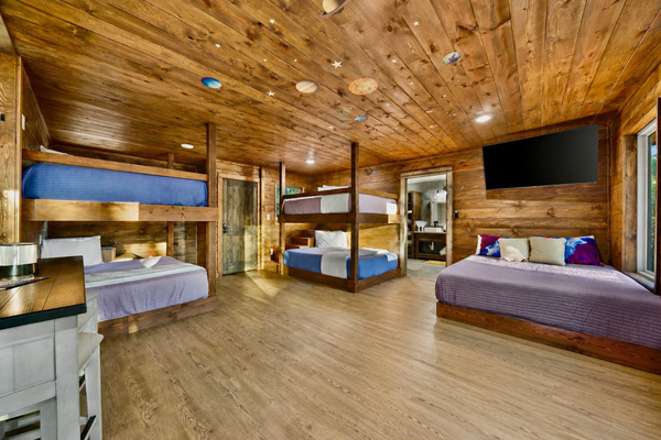 Spacious bunk loft with 5 queen beds — no twin beds, no pullouts, no cramped sleeping.