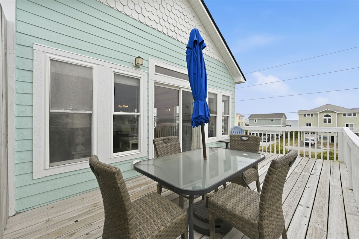 Outdoor deck with dining table and seating for al fresco meals
