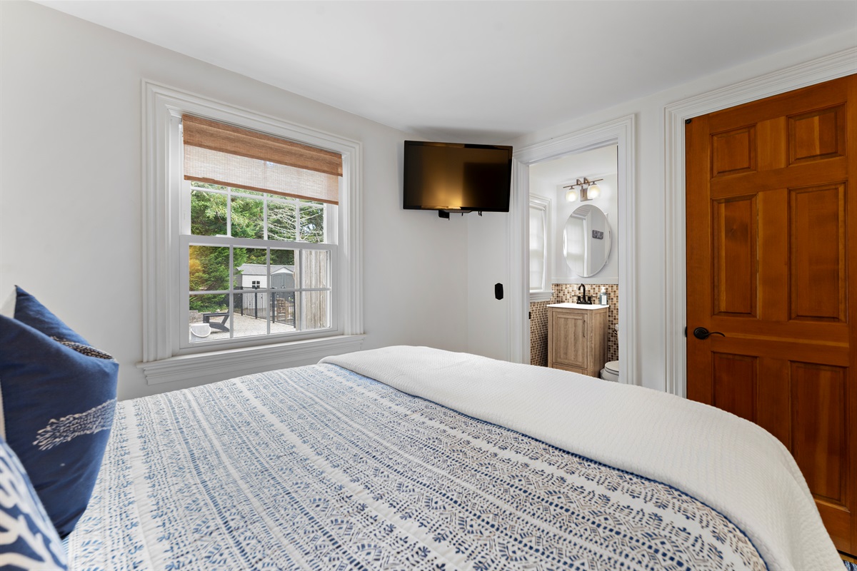 Relax in style with a spacious queen bed and your own en-suite half bathroom.