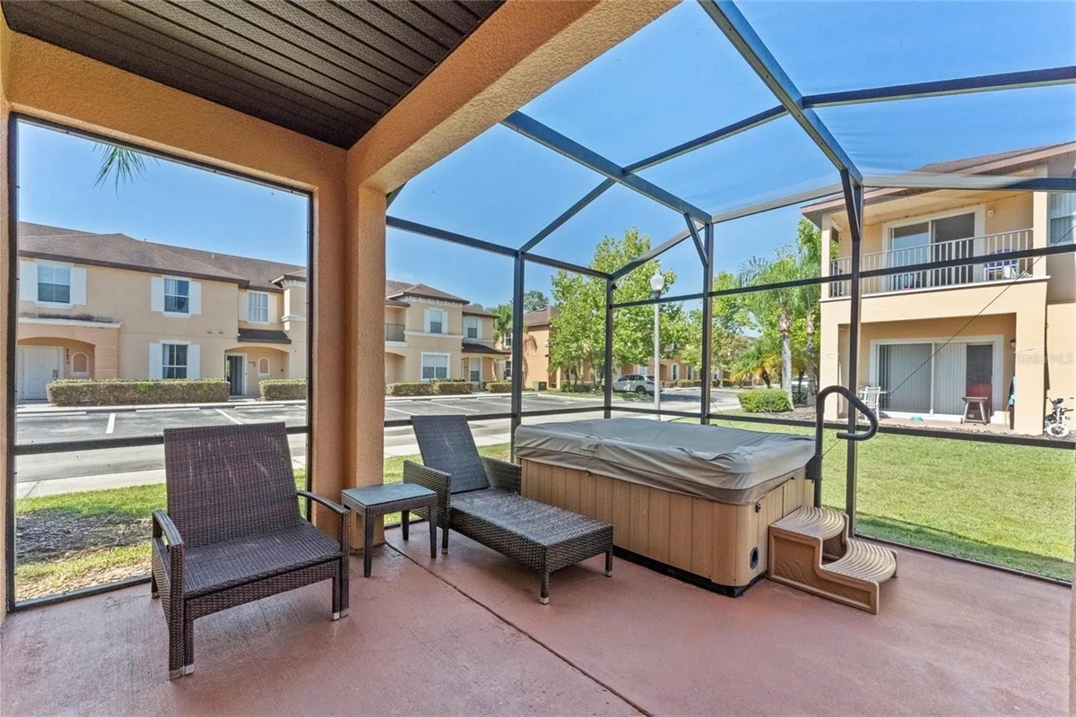 Private lanai with hot tub and lounge area