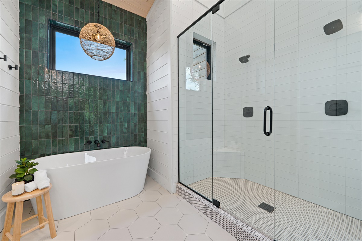 Suite #2 spa-like bath is simply divine with an option to relax in the large soaking tub or enjoy the huge shower for two