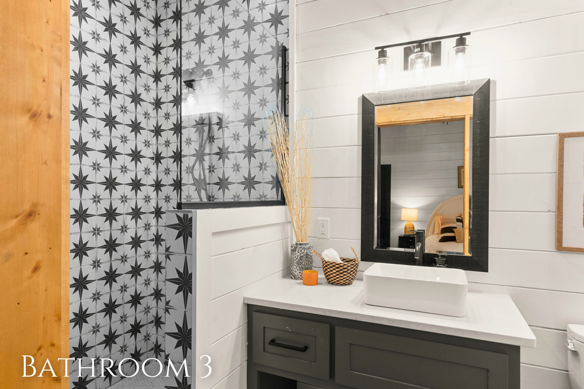 This Bathroom is a delightful fusion of contemporary style and playful patterns.