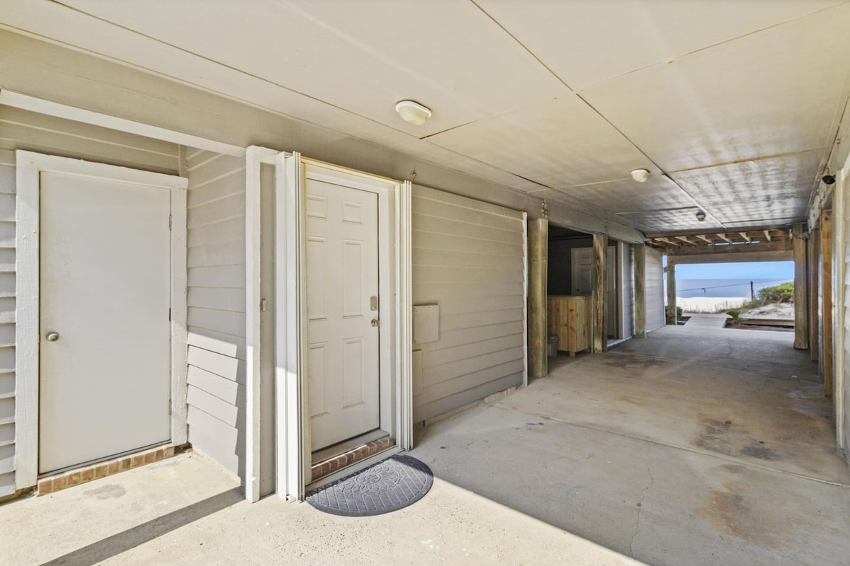 Park both vehicles in the covered two-car carport and walk directly to beach access &mdash; no shuttles, no lots.