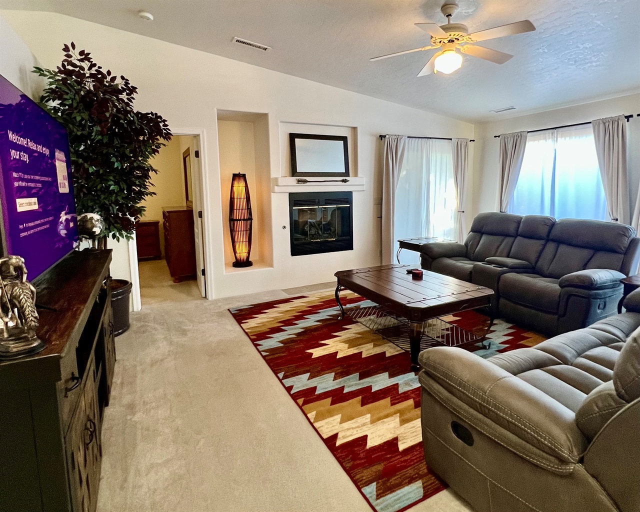 Experience true relaxation in the inviting living room, bathed in natural light