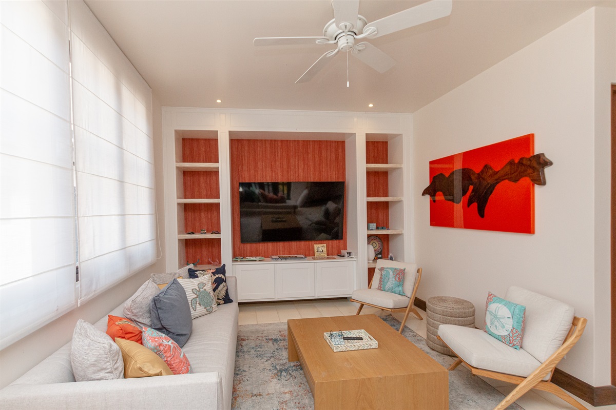 The large living room with smart TV is perfect for movie night with the family.