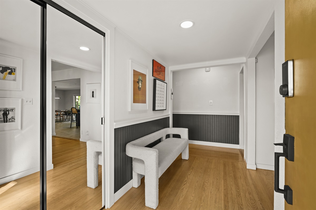 Step into a warm and welcoming entryway that sets the tone for your Napa getaway, with stylish décor and easy access to the home's main living spaces.