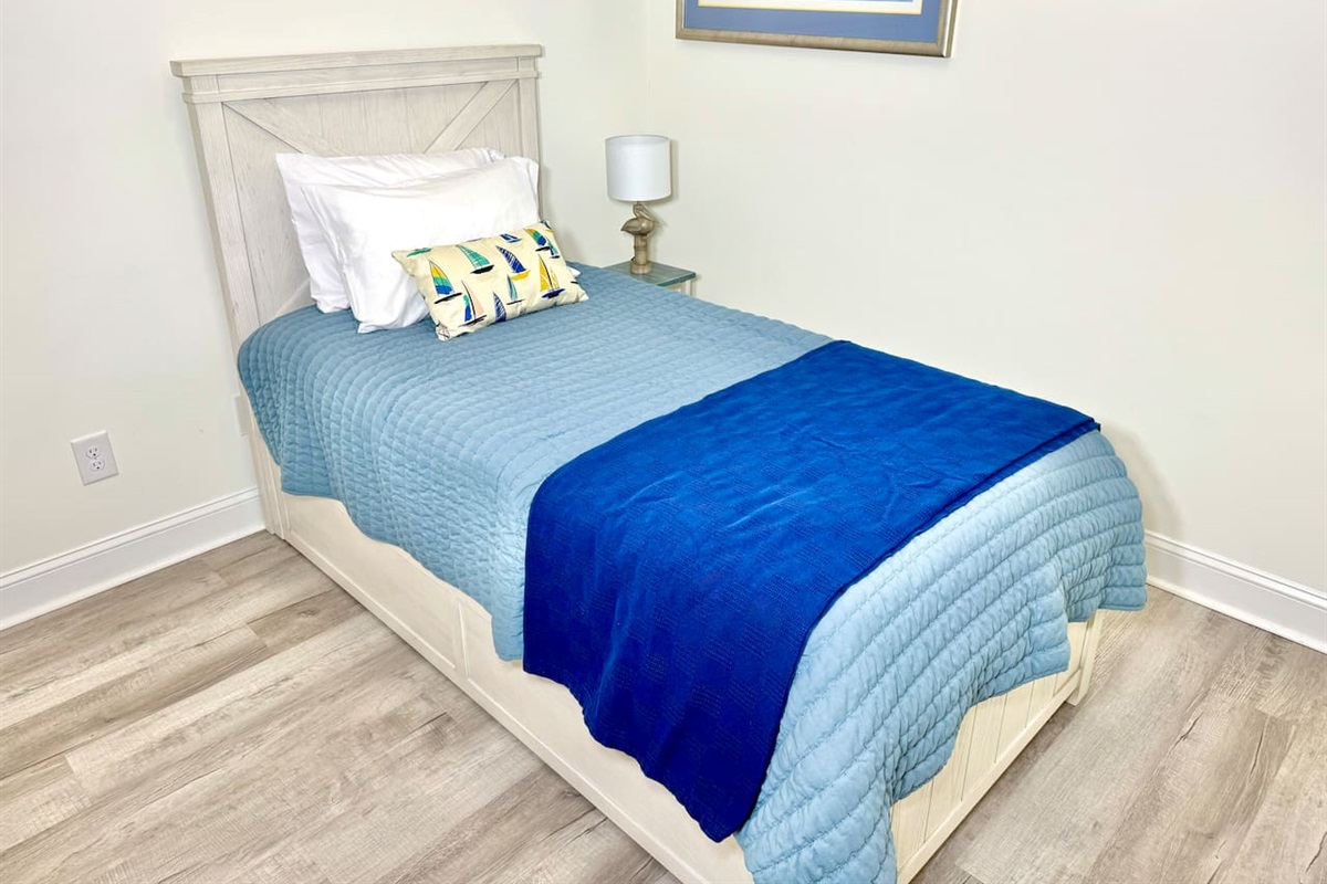 Twin trundle bed with blackout curtains. Linens for bottom twin trundle bed in closet. 