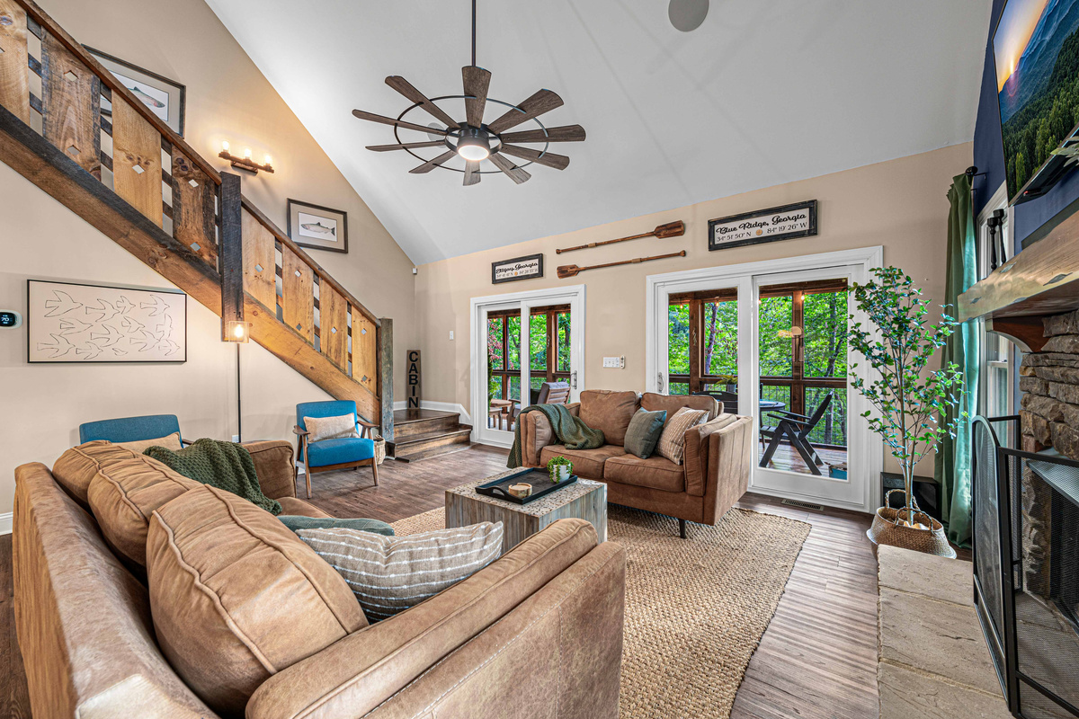 Living room with cozy seating and easy access to the screened-in deck.