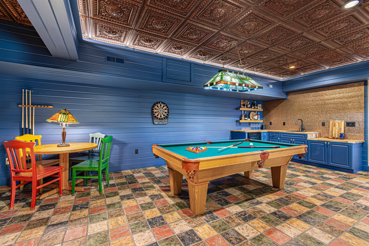 Game Room: Unleash your competitive spirit with pool, darts, and colorful decor!