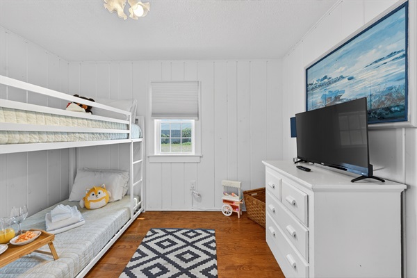 Second bedroom featuring a twin-size bunk bed.