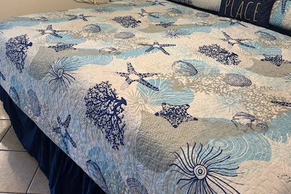 King size bed - (configured as two twins pushed together with King bedding).