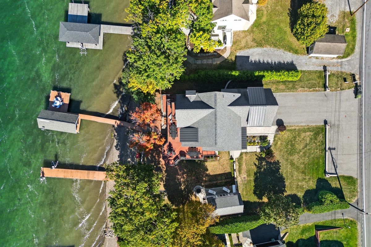 Aerial shot of property with dock right on the lake.