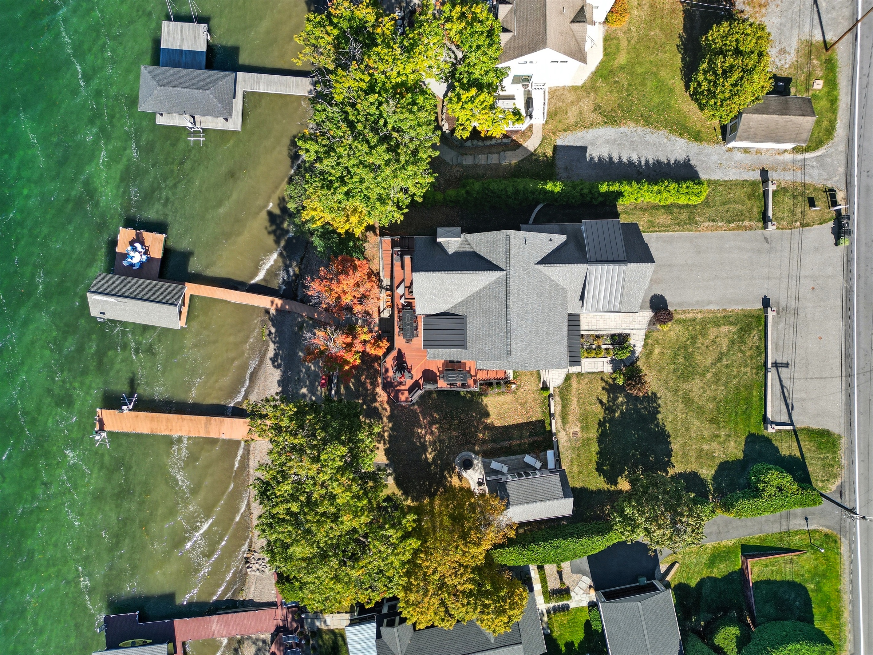 Aerial shot of property with dock right on the lake.