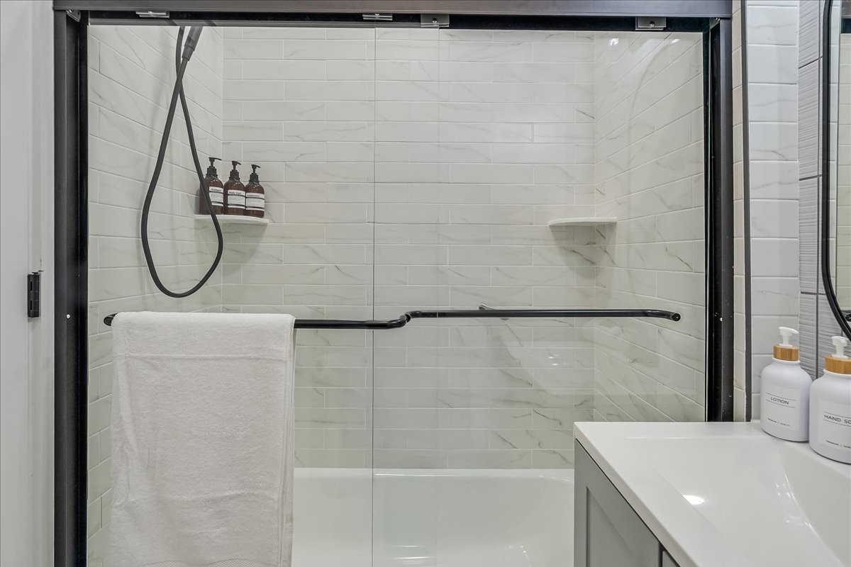 Unwind in this beautifully designed bathroom with a full bathtub.