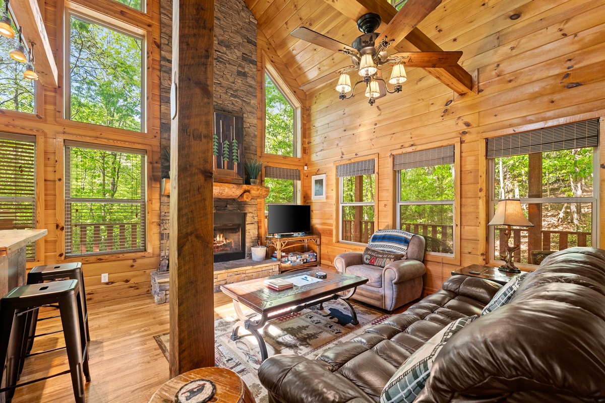 Open Living Room with Wood Burning Fireplace and Smart TV