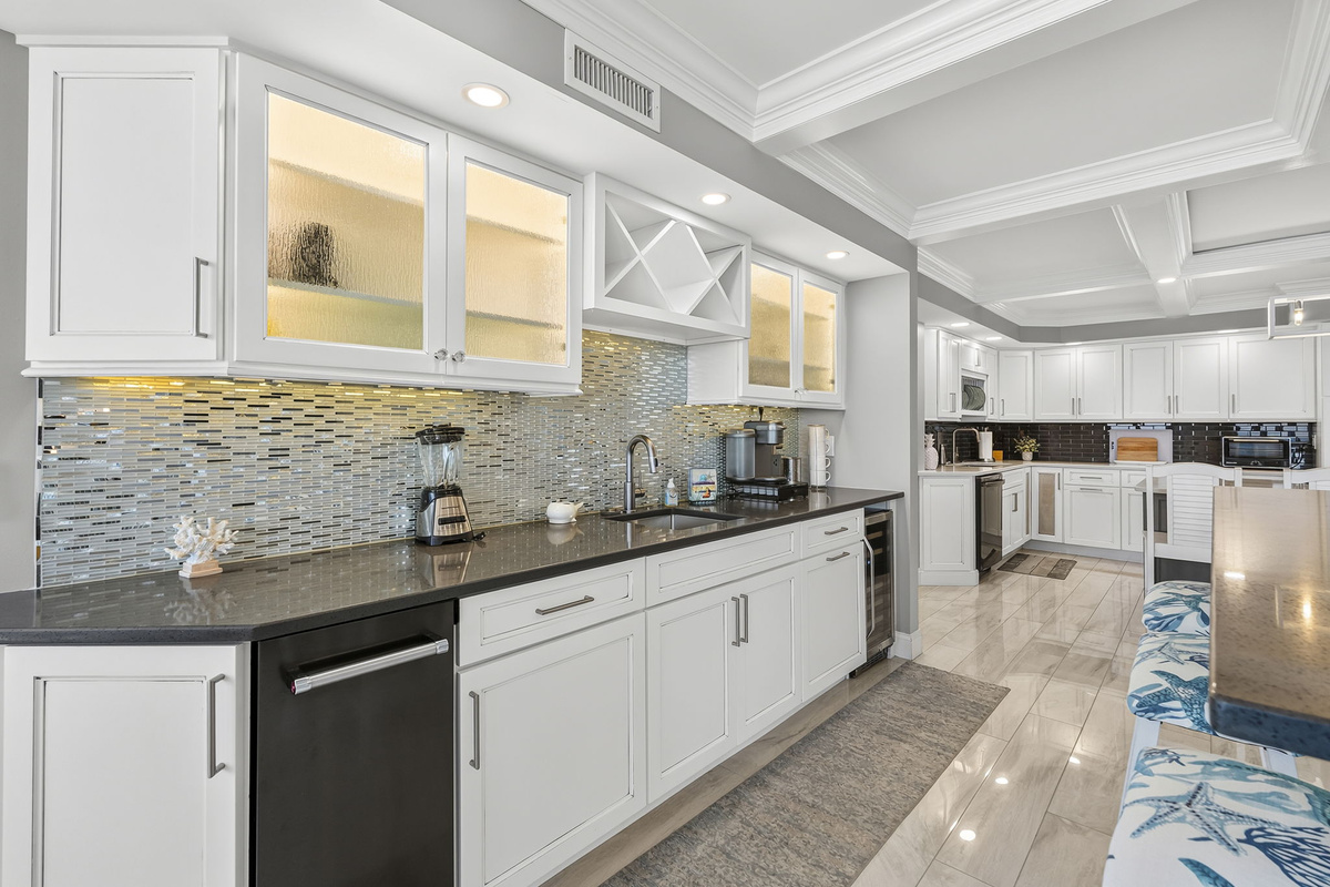Full wet bar with wine refrigerator and ice maker freezer