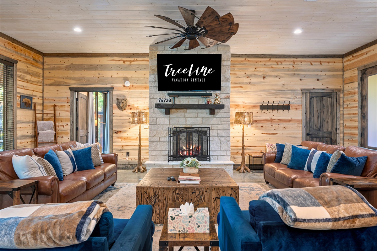 This inviting living room is the perfect place to unwind by the fireplace after a day of exploring the great outdoors.