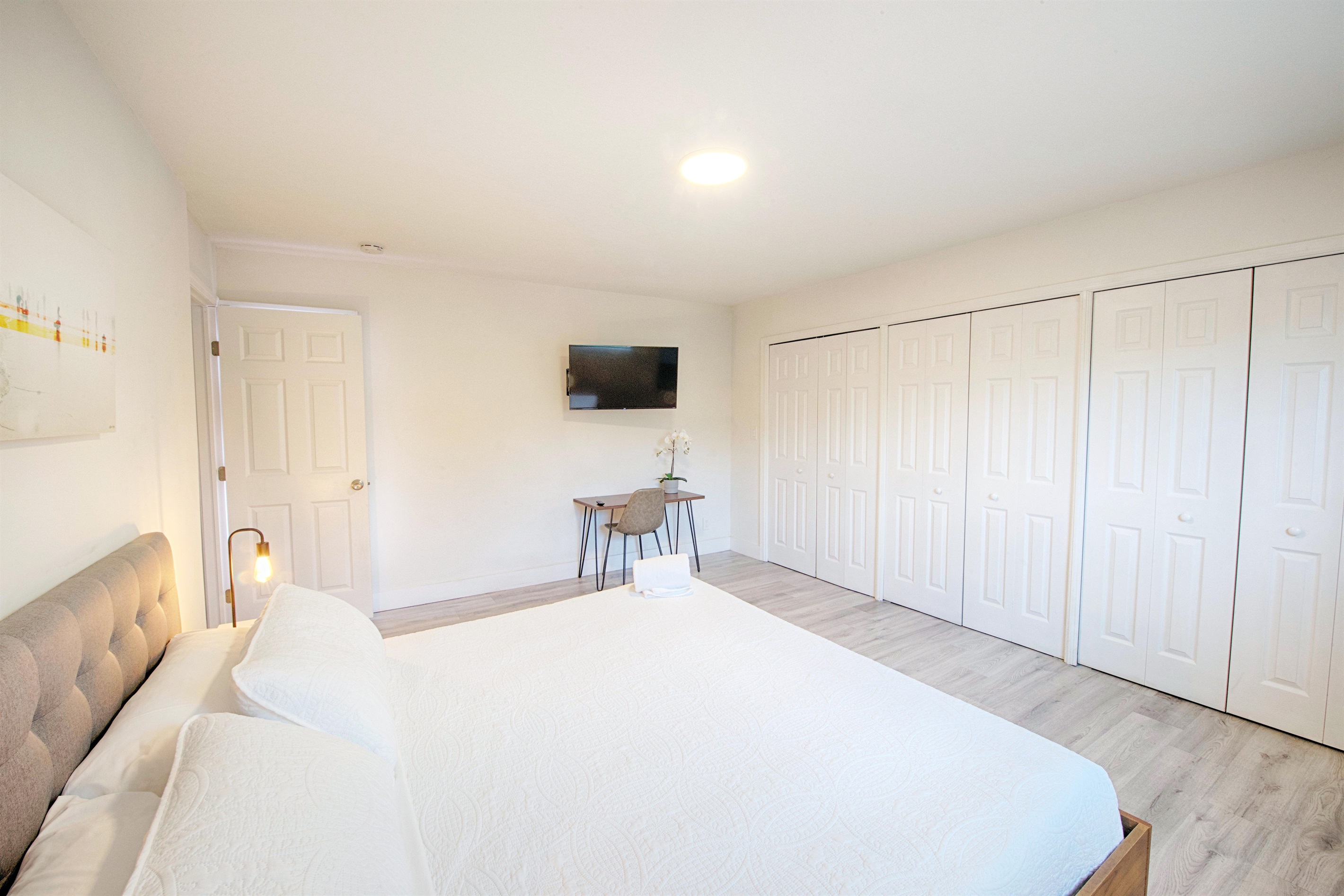 Second view of primary bedroom with partial ocean view looking east.