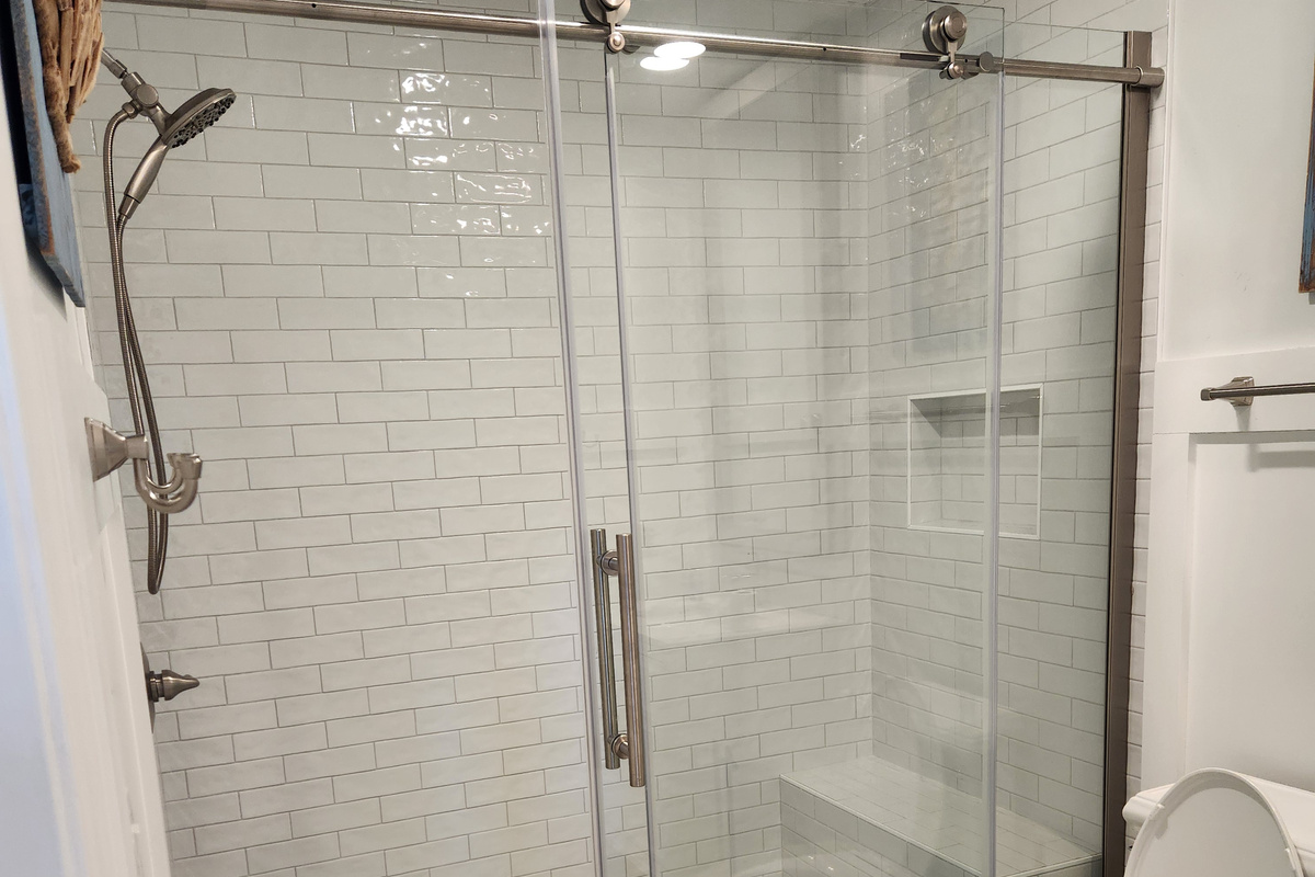 Beautifully updated shower in downstairs bathroom serving the bunk bedroom