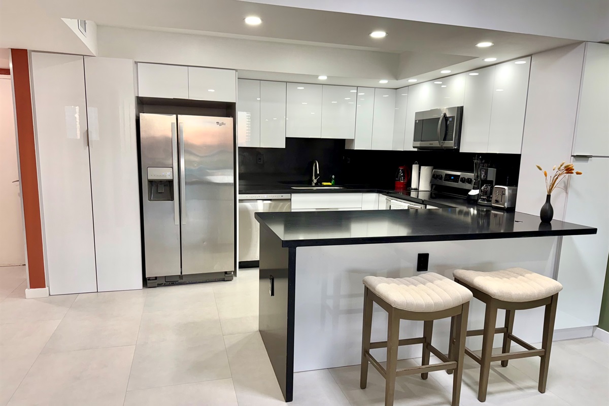 Full Kitchen with stainless steel appliances and laundry inside the apartment ! 