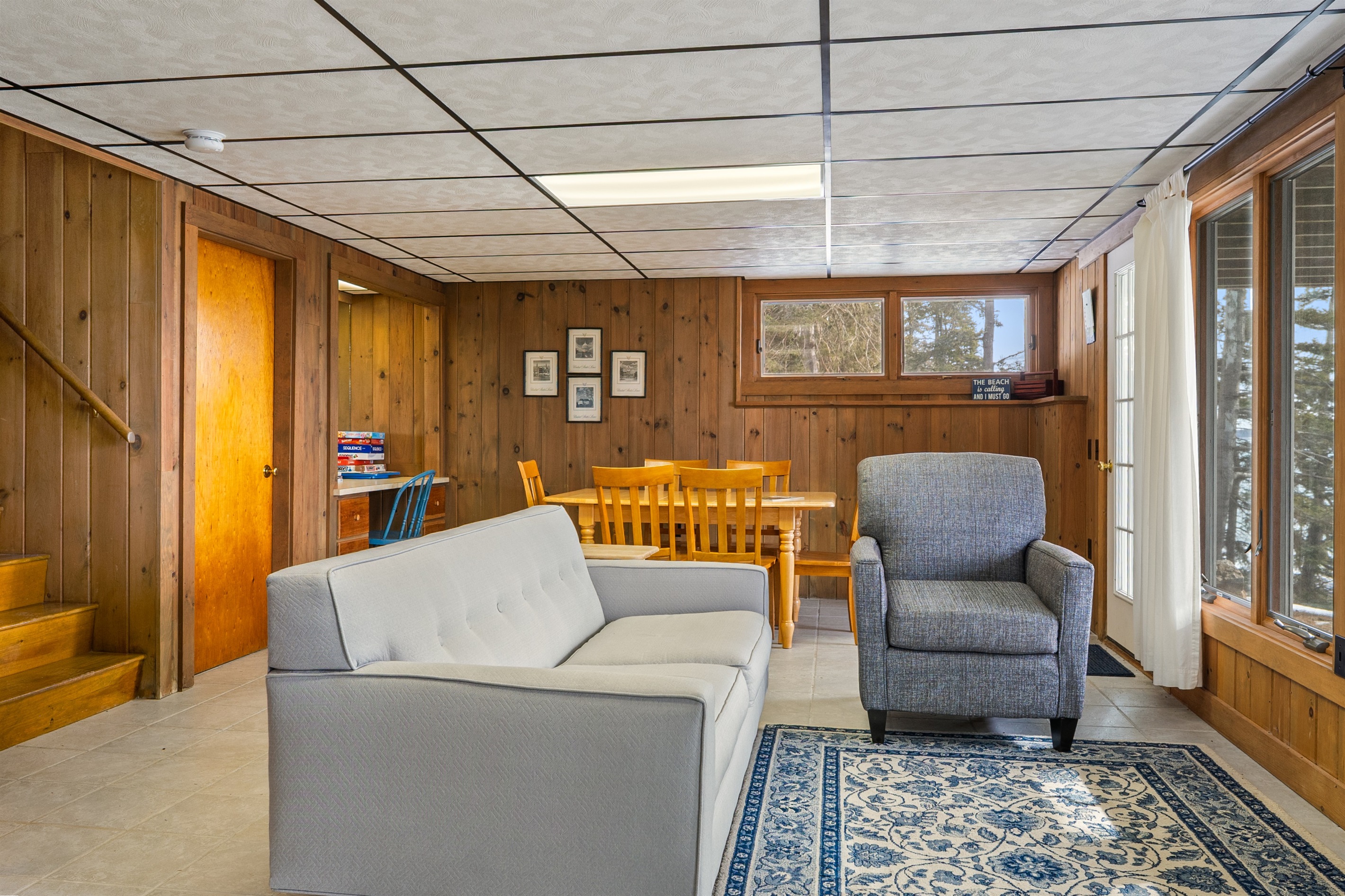 Lower Level Entertainment Room - Couch - Chair - Table with 6 Seats