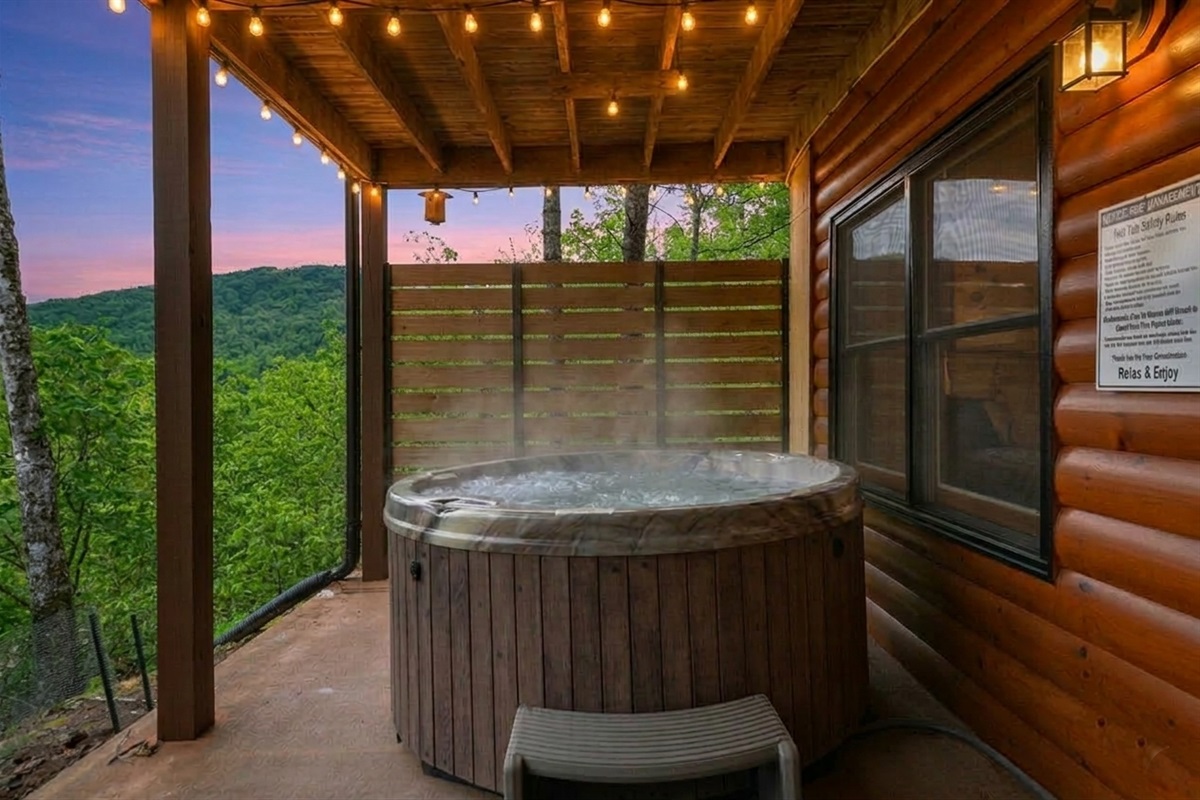 The hot tub at Luna's Mountain Lodge as the mountains turn gold at dusk